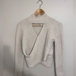 Cute Pink Rose cream sweater! Sized Medium and crisscrossed at the waist.